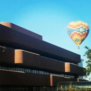 A hot-air balloon flies by campus